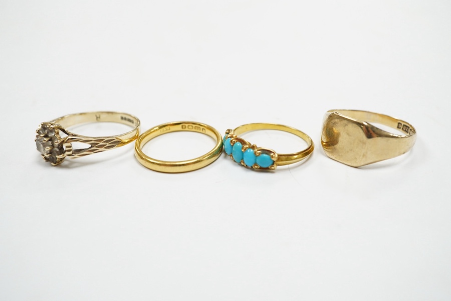 Four assorted rings, including a 22ct gold wedding band, 3.2 grams, two 9ct gold rings including a signet ring and a yellow metal and graduated five stone turquoise set half hoop ring, gross weight 7.3 grams. Condition -